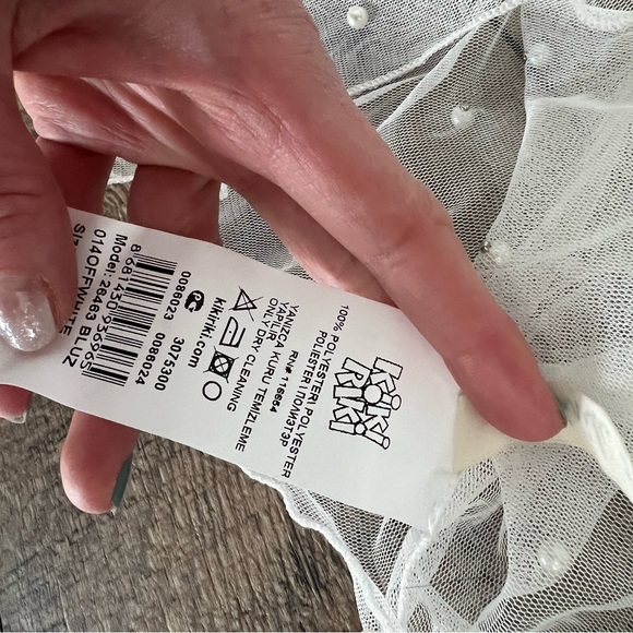 Off-White mesh long sleeve mock neck crop top with front tie and pearl details. - Picture 4 of 6